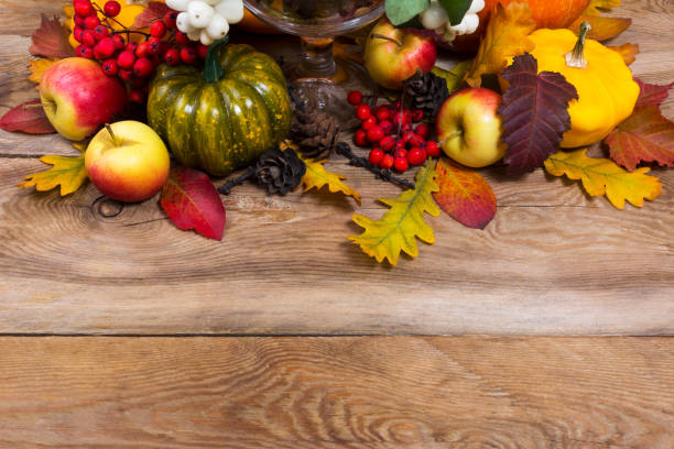 istock Fall background with green pumpkin, yellow squash, oak leaves, copy space 864040326