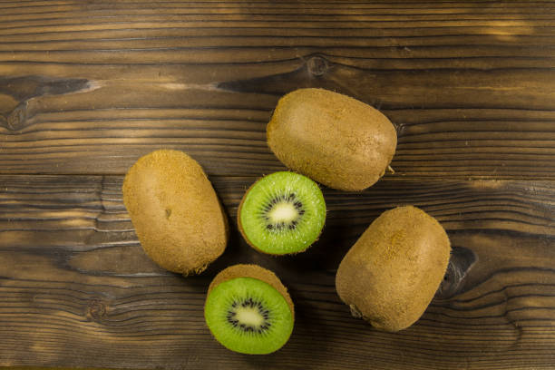 istock Kiwi fruits on wooden table 864041074
