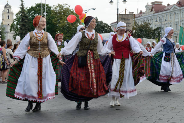 Parade in traditional Lithuanian Song Celebration Vilnius, Lithuania - July 6: Unidentified peoples parade in traditional Lithuanian Song Celebration on July 6, 2014 in Vilnius, Lithuania lithuania stock pictures, royalty-free photos & images