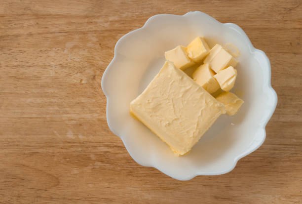 istock cube butter in white plate o wooden block 864050134