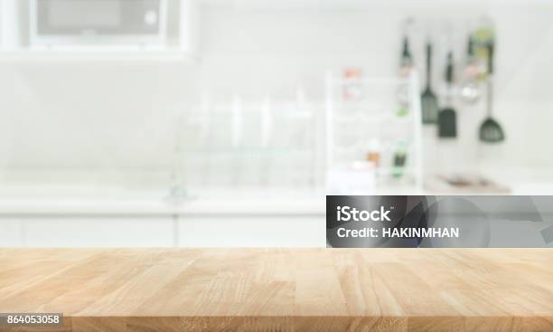 Wood Table Top On Blur White Kitchen Wall Room Stock Photo - Download Image Now - Kitchen, Kitchen Counter, Cooking