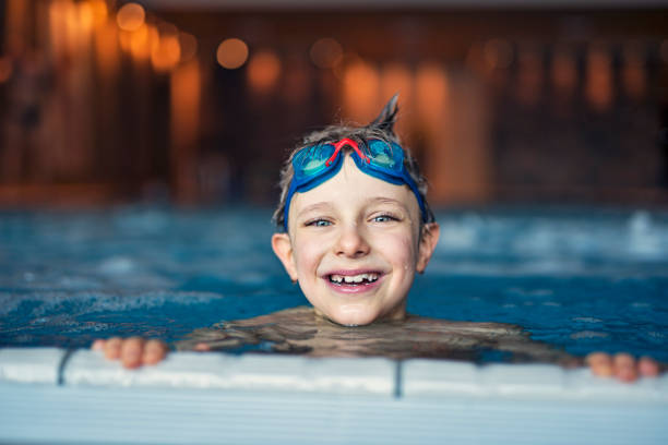 istock Little boy swimming at the swimming pool 864055650
