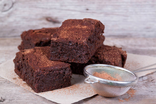 istock Chocolate brownie on wooden board 864073516