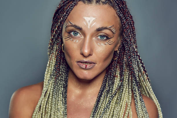 istock Girl with warrior make up 864124486