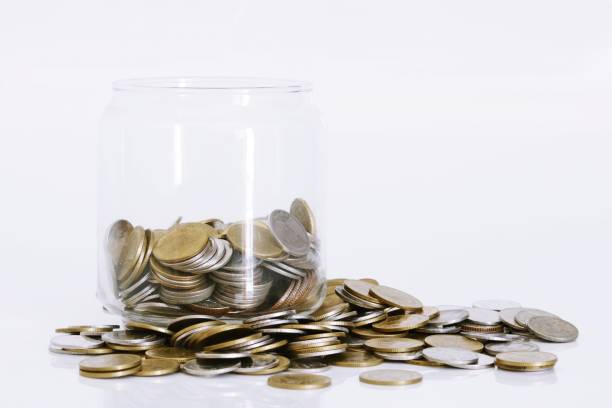 istock Coins in a glass bottle 864132314