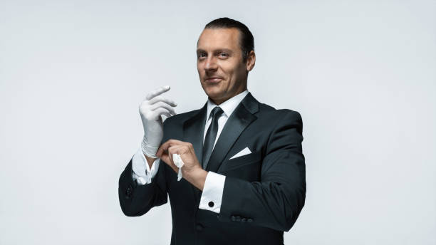 istock At Your service, well dressed man waiting for orders isolated on white background with copy space 864145564