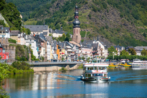 istock Town at the river with ship 864145700