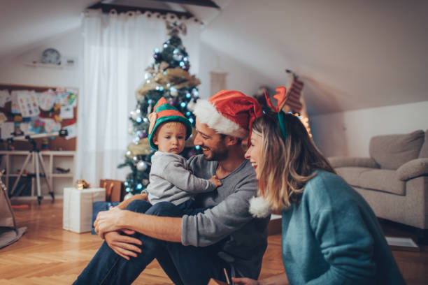 istock Young family celebrating Christmas 864146022