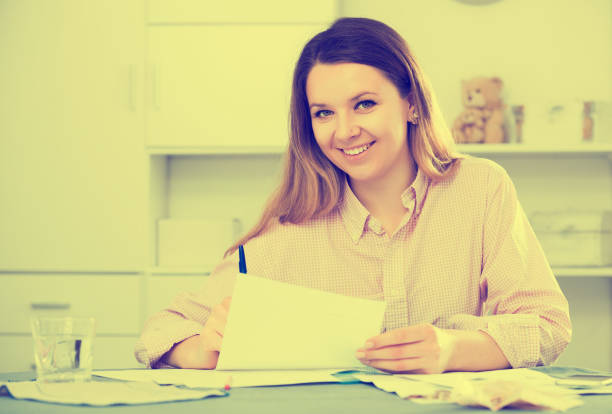 istock Girl signing agreement papers 864146116