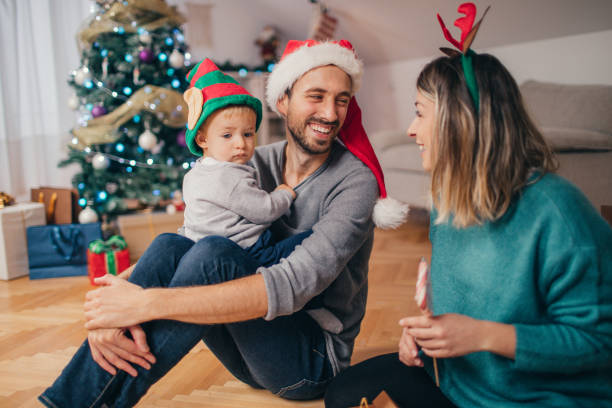 istock Young family celebrating Christmas 864146230
