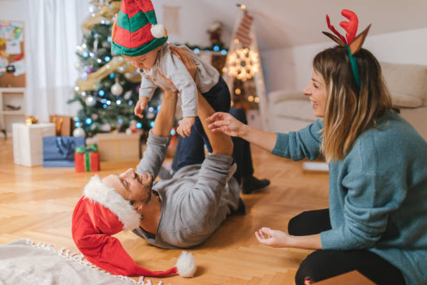 istock Young family celebrating Christmas 864148794