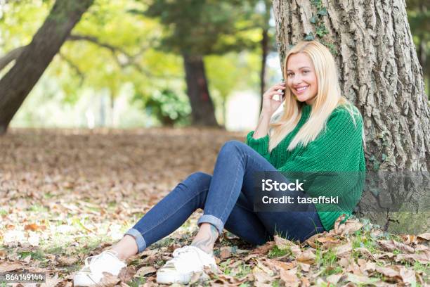 Smiling Woman Talking On Her Phone Stock Photo - Download Image Now - Adult, Adults Only, Arts Culture and Entertainment