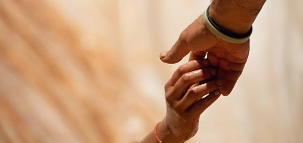 istock Couple hold hands,help when overcoming hindrances 864150982