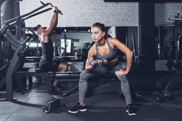 istock athletic woman with barbell 864152672