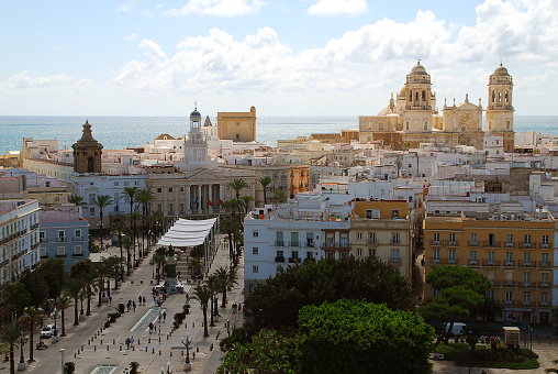 Panorama view of the town hall and the cathedral of Cadiz. The Ayuntamiento is the town hall of Cadiz's Old City. It is located at the Plaza de San Juan de Dios. Cadiz is a city and port in southwestern Spain, Europe.