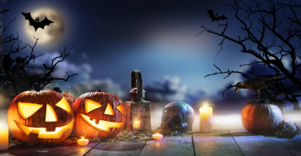 istock Spooky halloween pumpkins on wooden planks 864155392