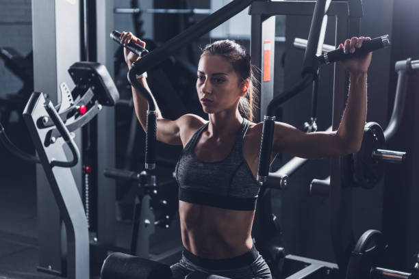 istock woman working out in gym 864157990