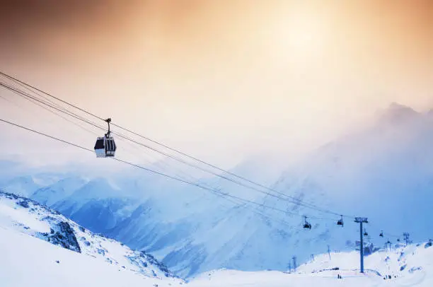 Ski slope and cable car on the ski resort Elbrus. Caucasus, Russian Federation. Winter landscape