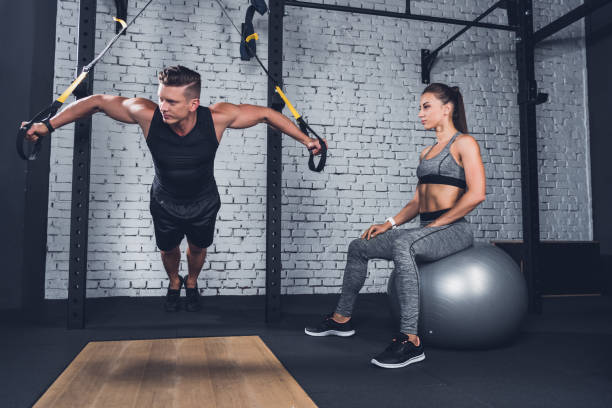 istock athletic couple in gym 864158584