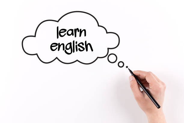 istock Hand writing LEARN ENGLISH on white paper, View from above 864161086