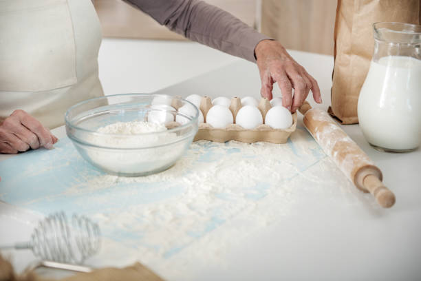 istock Skillful mature woman making dough from meal 864161202