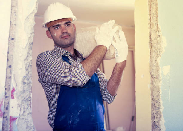 istock Portrait of builder with package of plaster 864165354