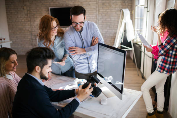 istock Group of young perspective designers working with camera 864165728