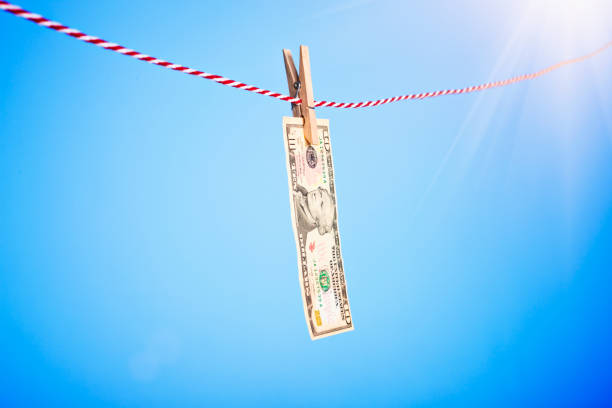 istock One American banknote hung out to dry 864170014