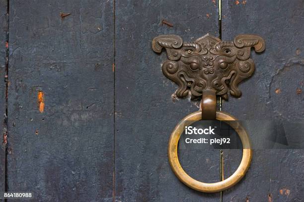 Dragon Son Chinese Door Knocker With A Golden Colored Ring On A Stock Photo - Download Image Now