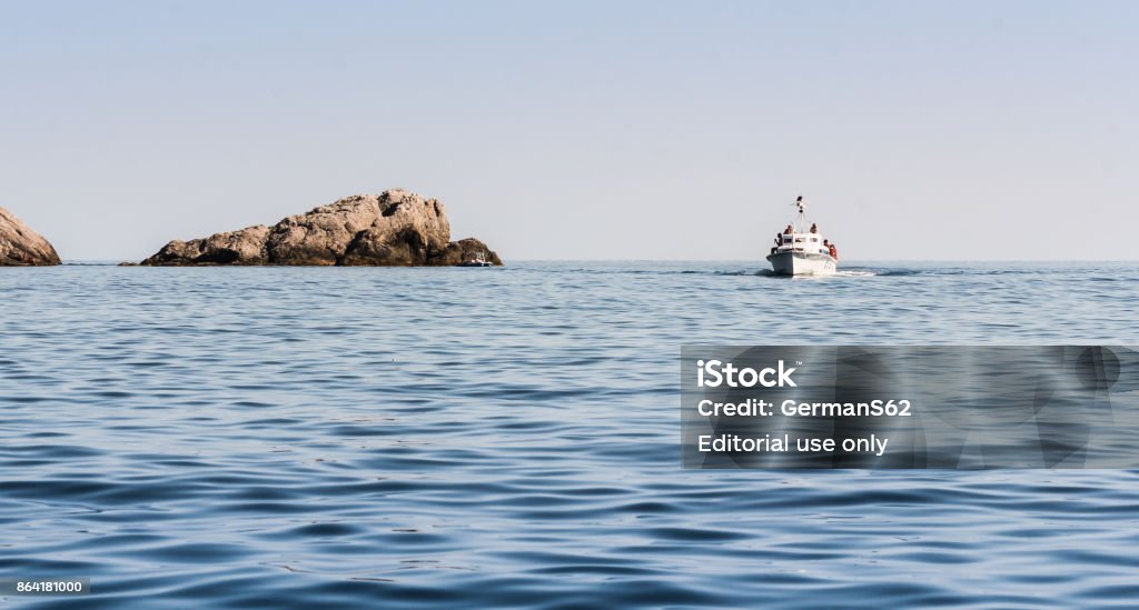A boat in the sea by the stone. New World, Crimea - 12 July, 2017. Beauty Stock Photo