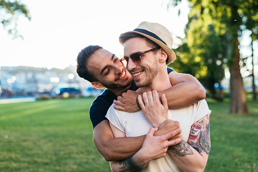 Gay couple traveling around Europe and exploring capital cities and places of interest. Homosexual couples and friends travel to attractive destinations and making new friendships and relationships with local gay communities.