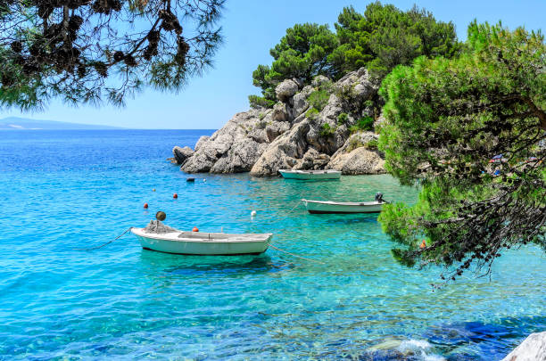 istock Boats are parked by the sea. 864209272