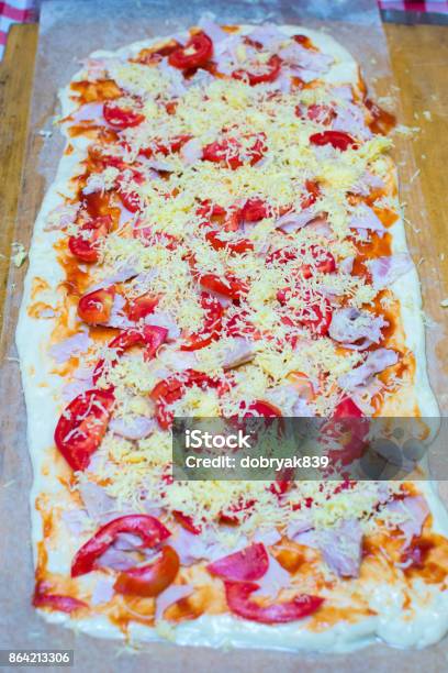 Large Rectangular Pizza Sliced On A Wooden Board Stock Photo - Download Image Now - Appetizer, Basil, Butter