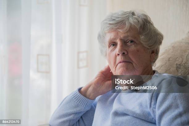 Senior Woman Indoors Looking Upset And Bored Stock Photo - Download Image Now - Senior Women, Serious, Sadness