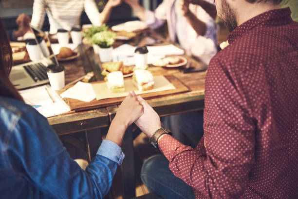 istock Prayer is a good way to start a meeting 864238398