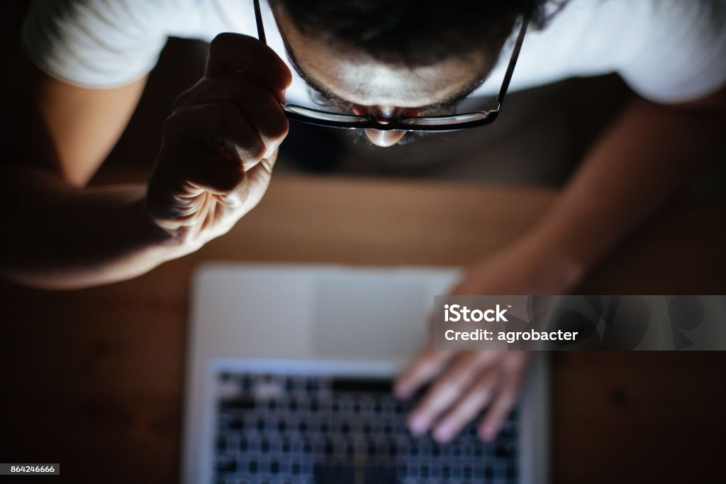 Cyber Attacks Computer hacker stealing information with laptop White Collar Crime Stock Photo