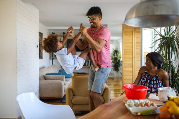 istock Family having fun in the kitchen while making cookies 864247176