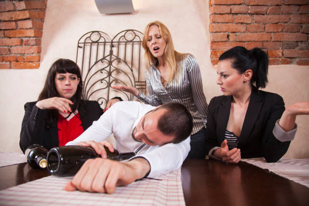 istock Drunk men at a company party 864255910