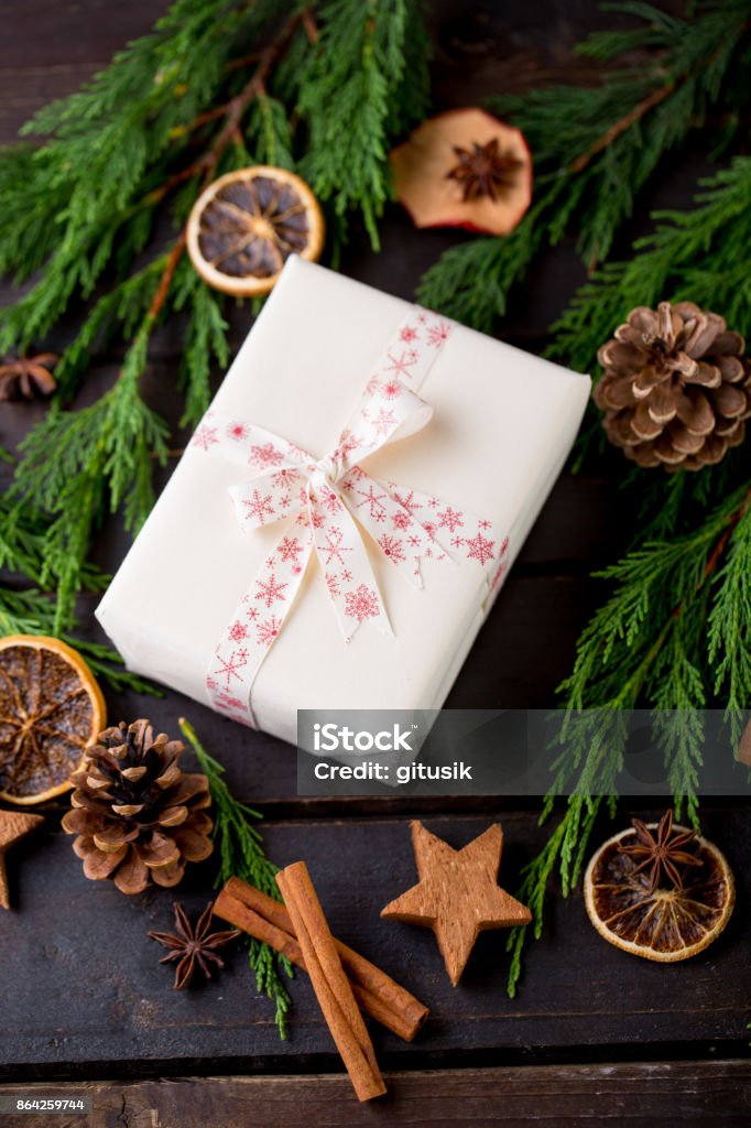 Christmas gift on the antique wooden background. Arm Stock Photo