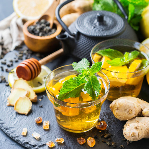 istock Japanese chinese tea teapot lemon ginger mint honey 864263018