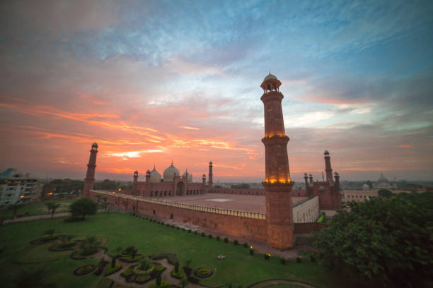 The Emperor's Mosque - Badshahi masjid wide angle full exterior at sunset The Emperor's Mosque - Badshahi masjid wide angle full exterior at sunset lahore pakistan photos stock pictures, royalty-free photos & images
