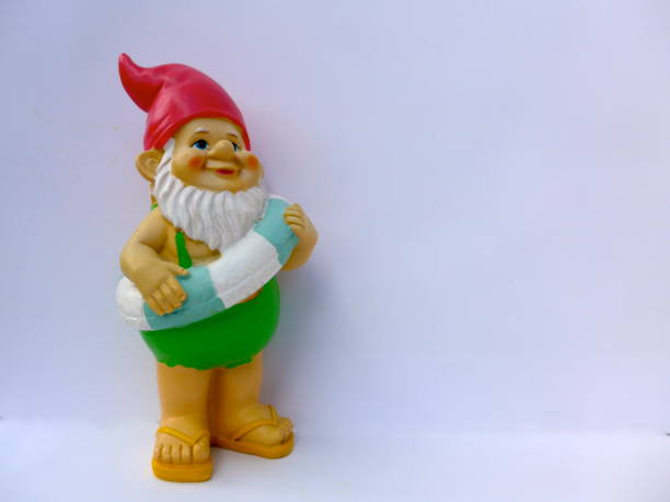 istock Funny garden dwarf makes seaside holiday 864264018