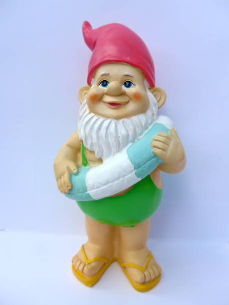 istock Funny garden dwarf makes seaside holiday 864264070