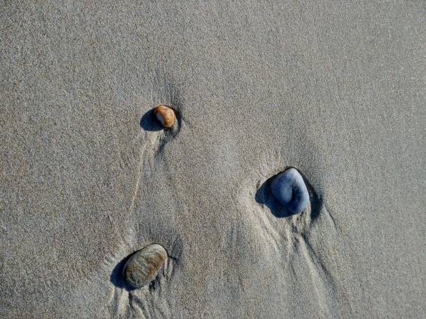 istock Sand and 3 boulders 864273108