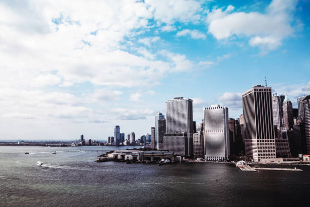 A cityscape view of downtown Manhattan, New York City from the air on the East River side.  Horizontal with copy space