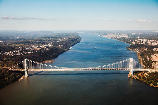 A high angle view of the George Washington Bridge, spanning the Hudson River from New York City to New Jersey.  Wide angle shot.