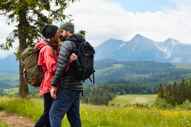 istock Young couple kissing in the mountains 864291352