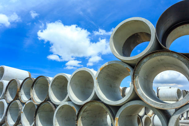 istock Stack of concrete drainage pipes for wells and water discharges 864291500