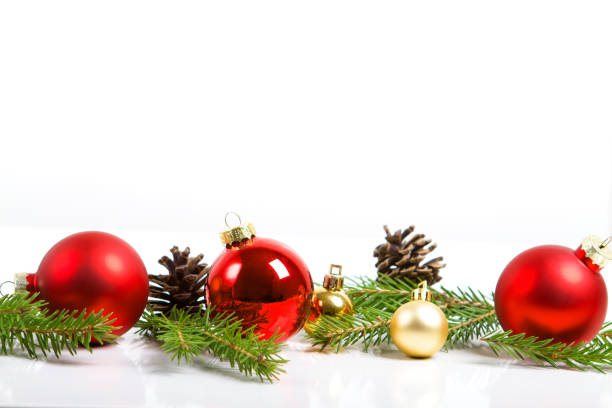 istock Red merry christmas ornaments and xmas tree on white 864295076