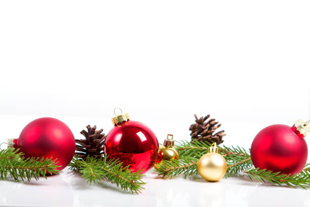 istock Red merry christmas ornaments and xmas tree on white 864295200